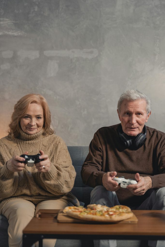 seniors playing local co-op with pizza
